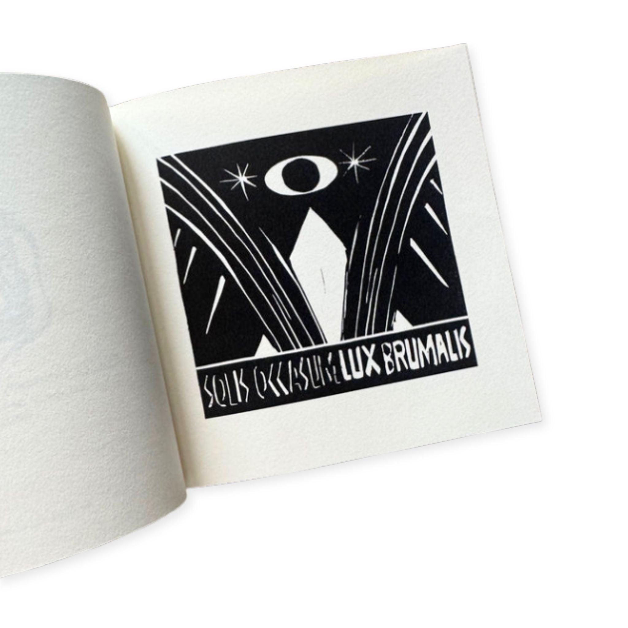 Open book with a black and white illustration on a white background