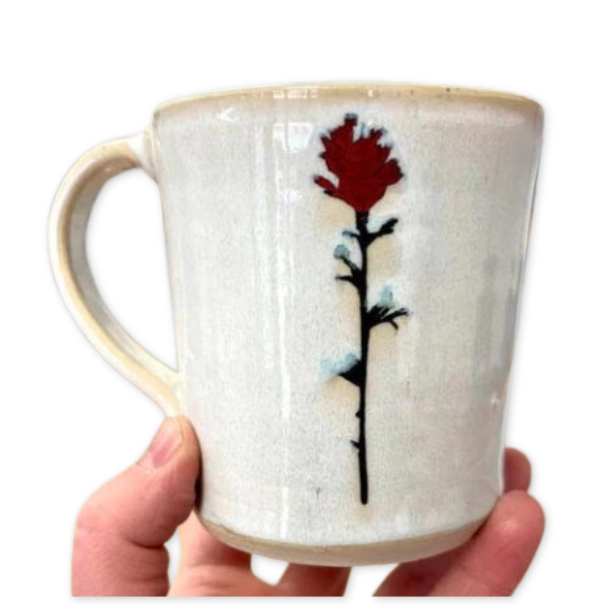 cream colored ceramic mug with an indian paintbrush design