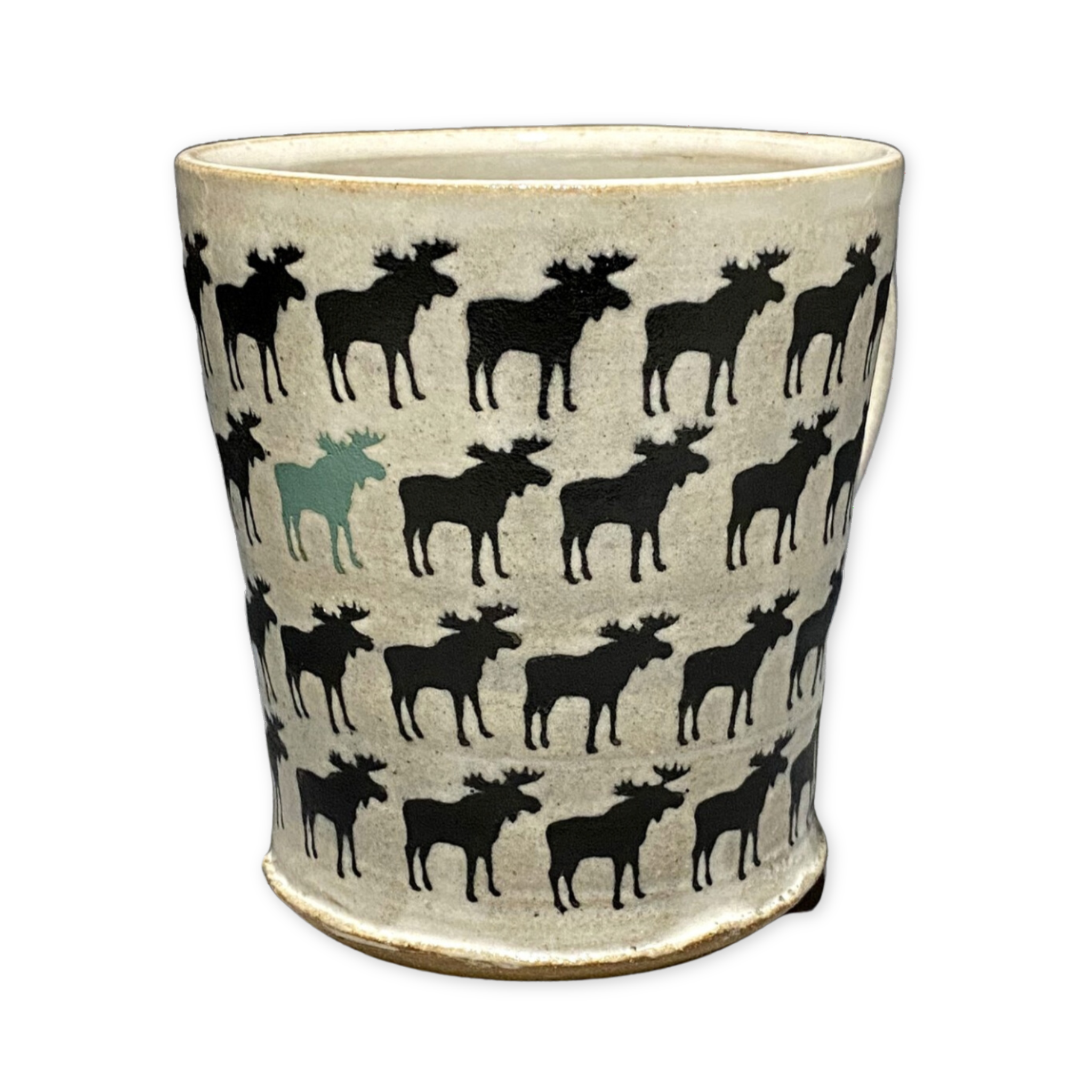 ceramic mug with multiple small black moose and one teal colored moose