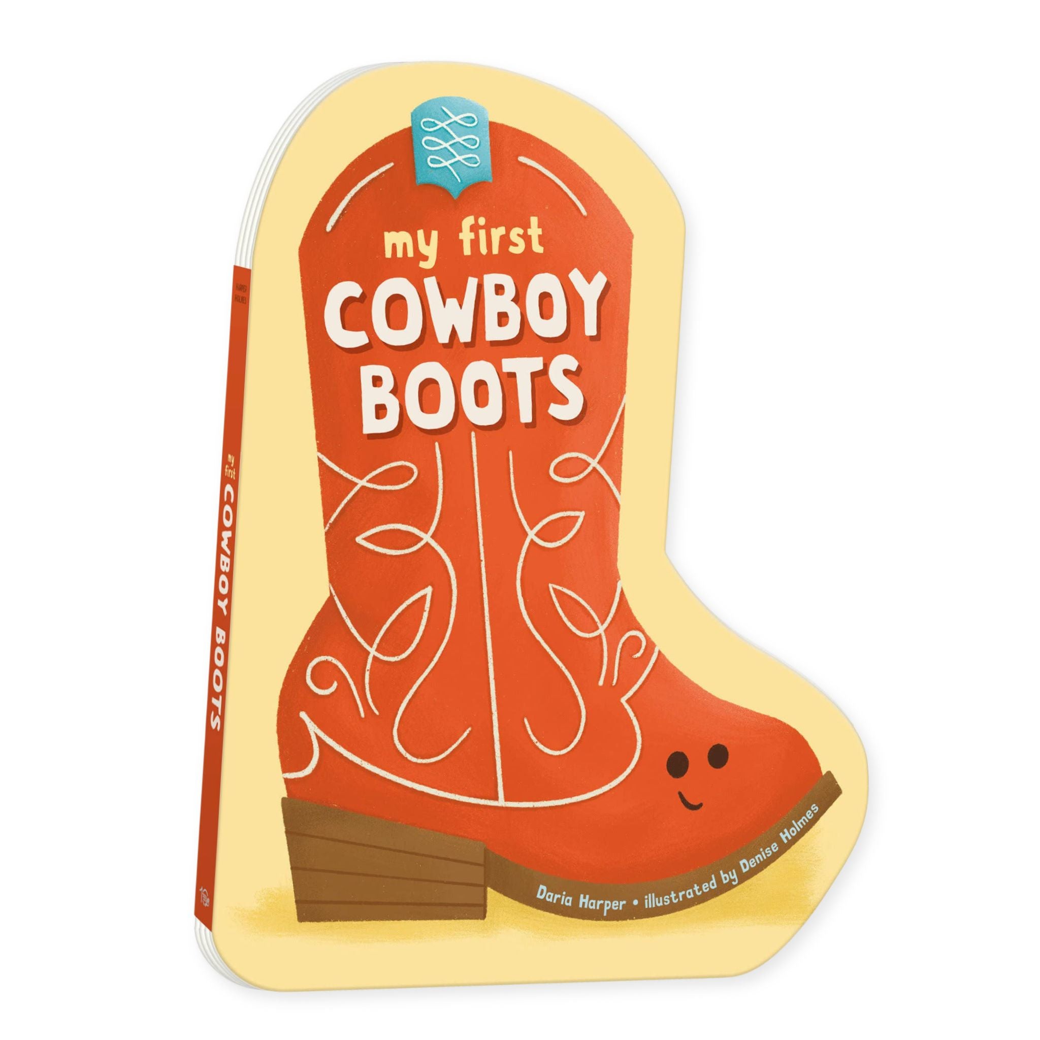 A children's hardcover board book shaped like a cowboy boot, titled "my first COWBOY BOOTS," with a cream-colored cover, orange boot illustration, and white title text on a white background.