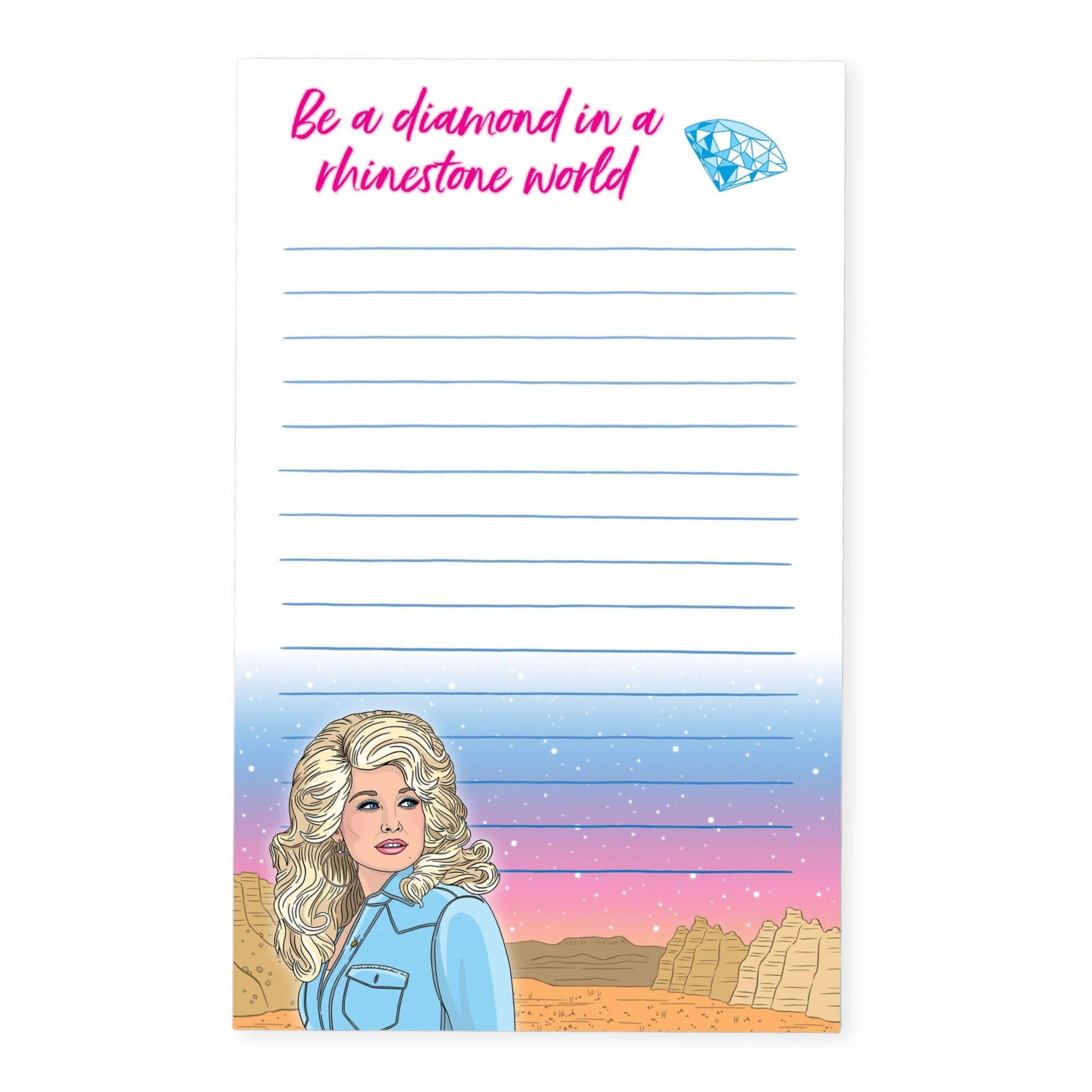 A vertical notepad with a white writing area, pink script text reading 'Be a diamond in a rhinestone world' at the top, a small blue diamond illustration, lined writing space, and an illustrated blonde woman in a desert landscape with a blue-to-pink gradient sky at the bottom.