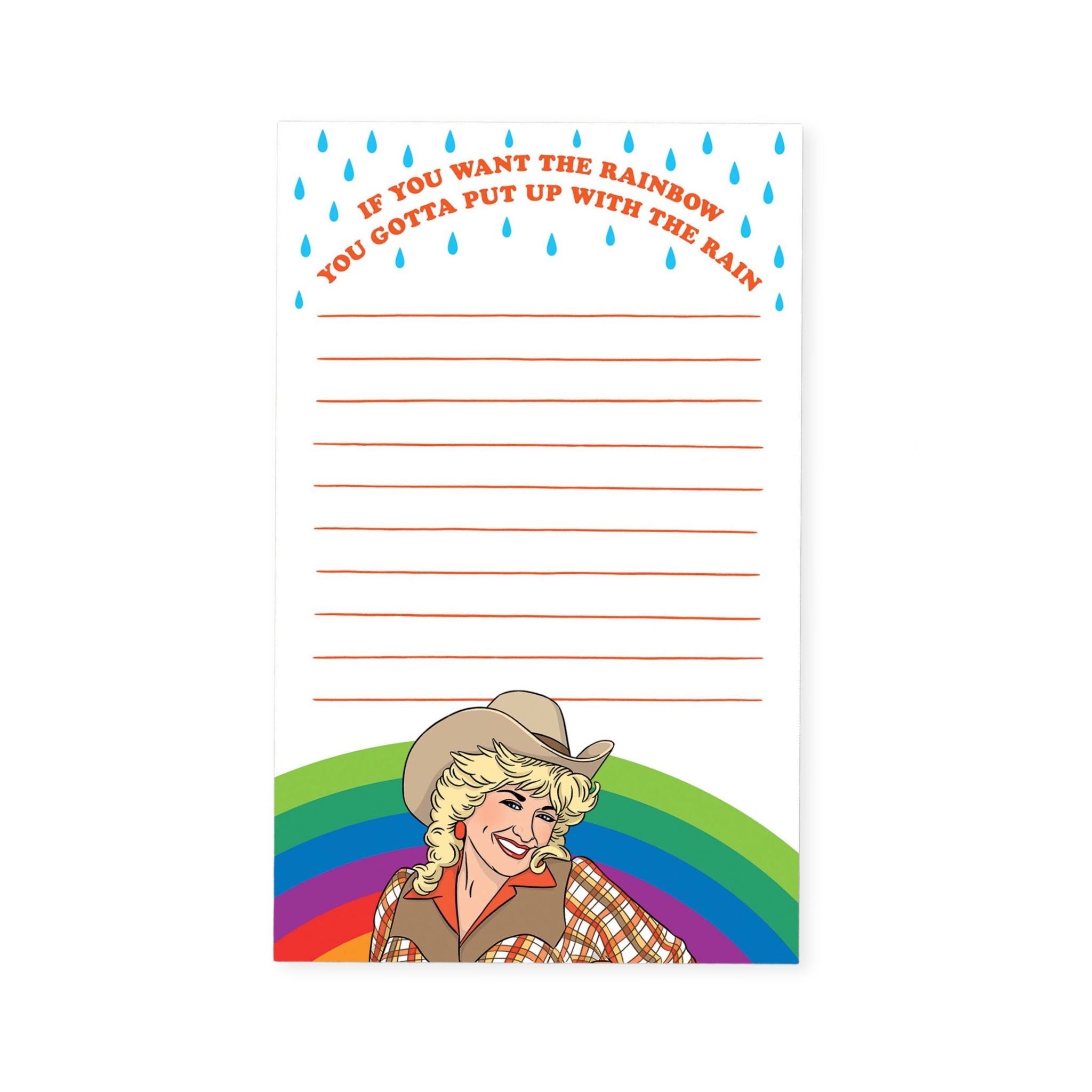 A vertical notepad or writing pad with a colorful western-themed design. The top features the phrase 'IF YOU WANT THE RAINBOW YOU GONNA PUT UP WITH THE RAIN' in orange text under blue raindrop shapes, with lined writing space in the center.