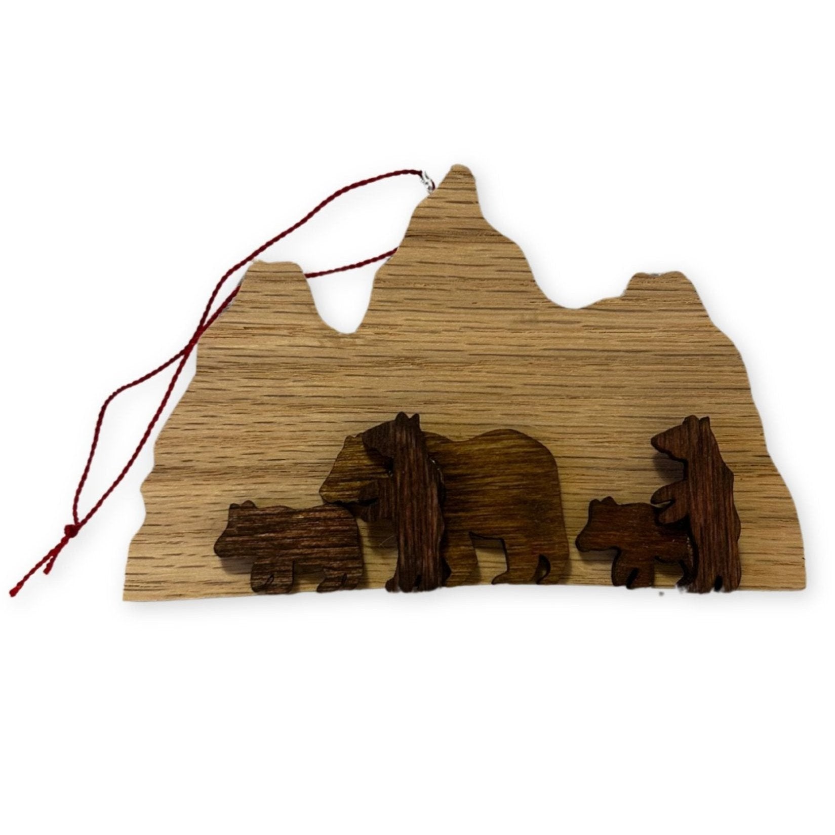 Wood ornament of 399 and cubs in tetons