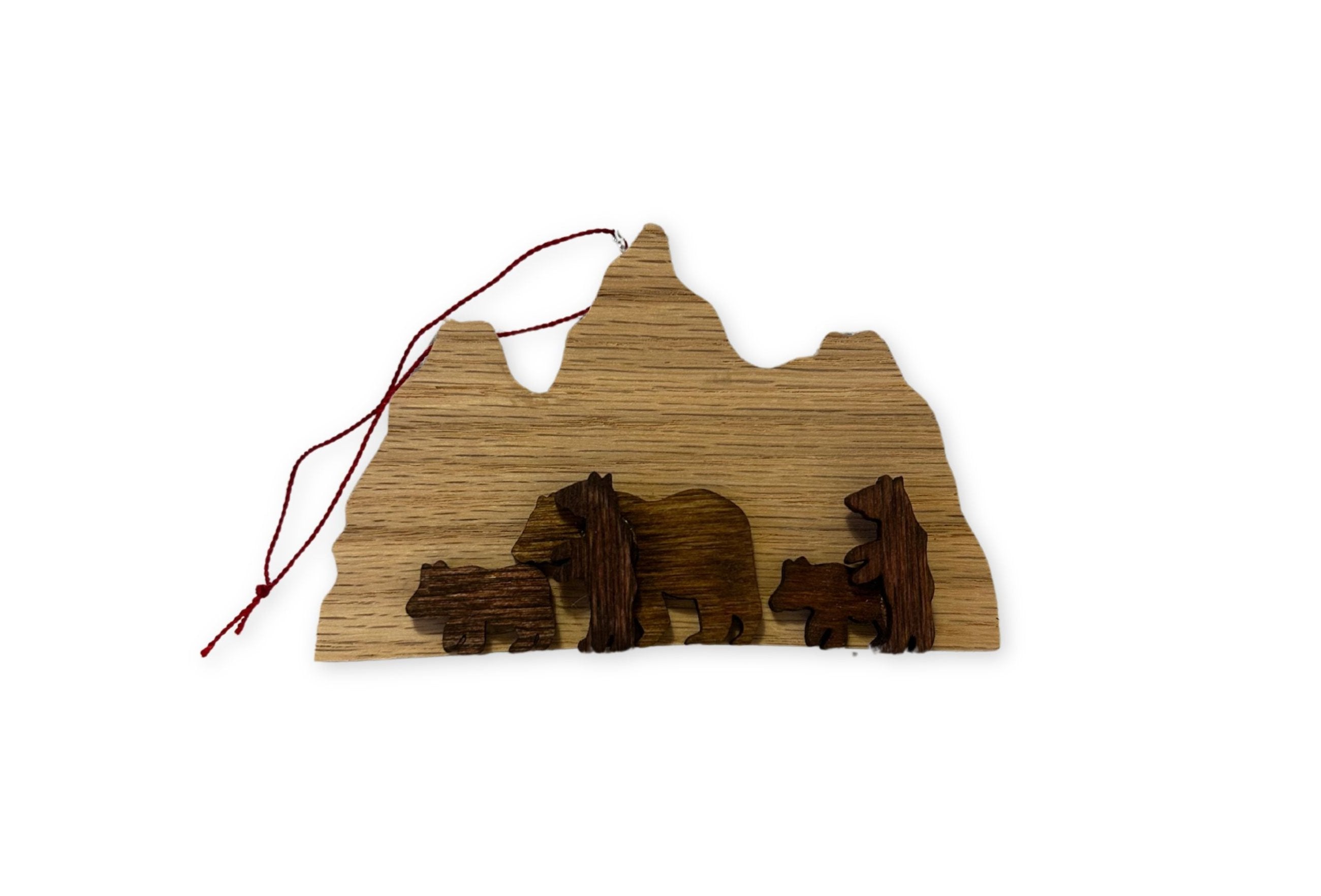 Wood ornament of 399 and cubs in tetons