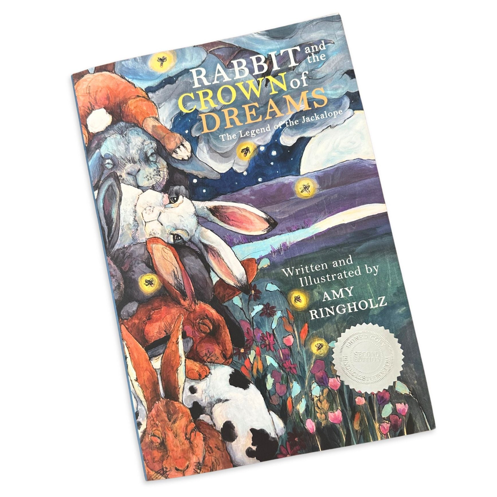 Book titled 'Rabbit and the Crown of Dreams' with illustrations on the cover.