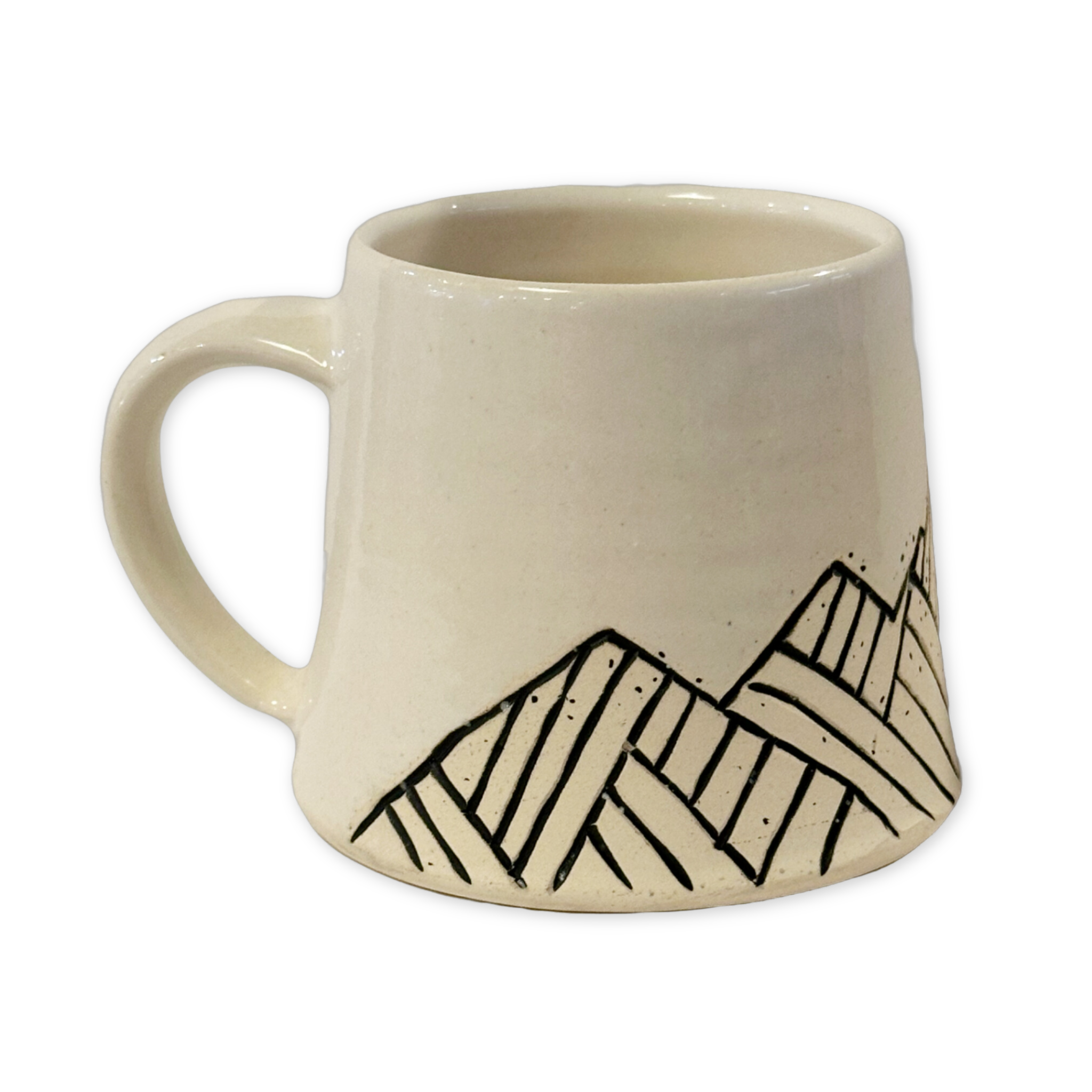 white ceramic mug with geometric design of teton mountain range