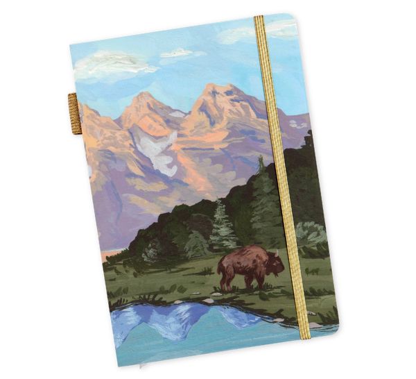 Notebook with a bear and mountain design on the cover