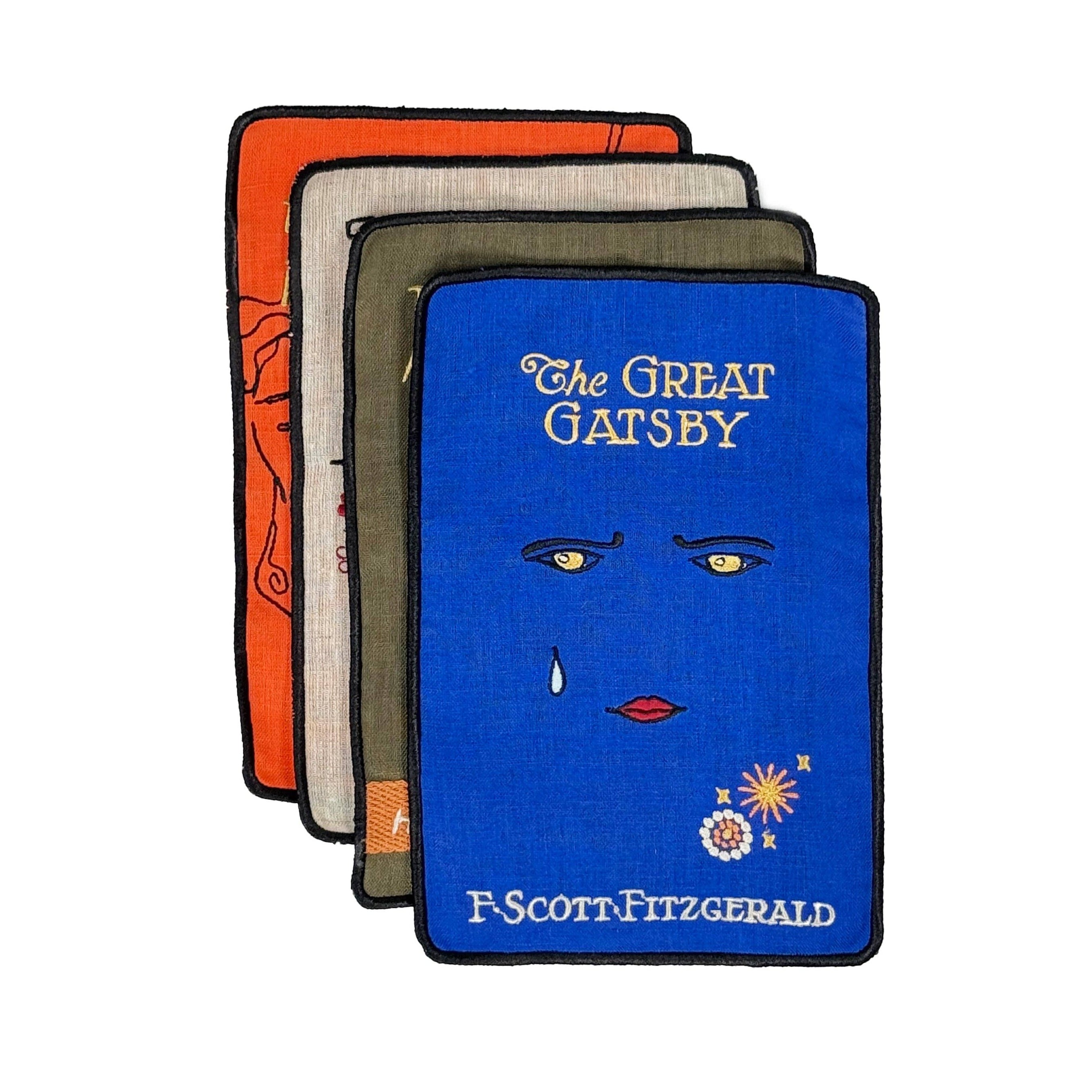 Four book covers of 'The Great Gatsby' by F. Scott Fitzgerald on a white background