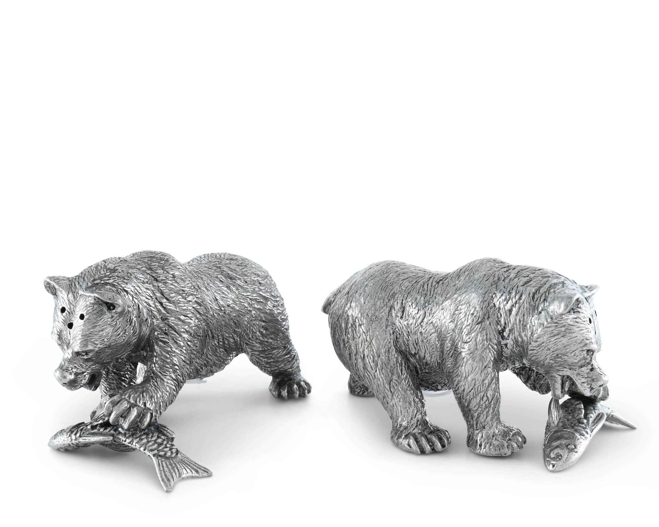 Two silver bear figurines on a white background
