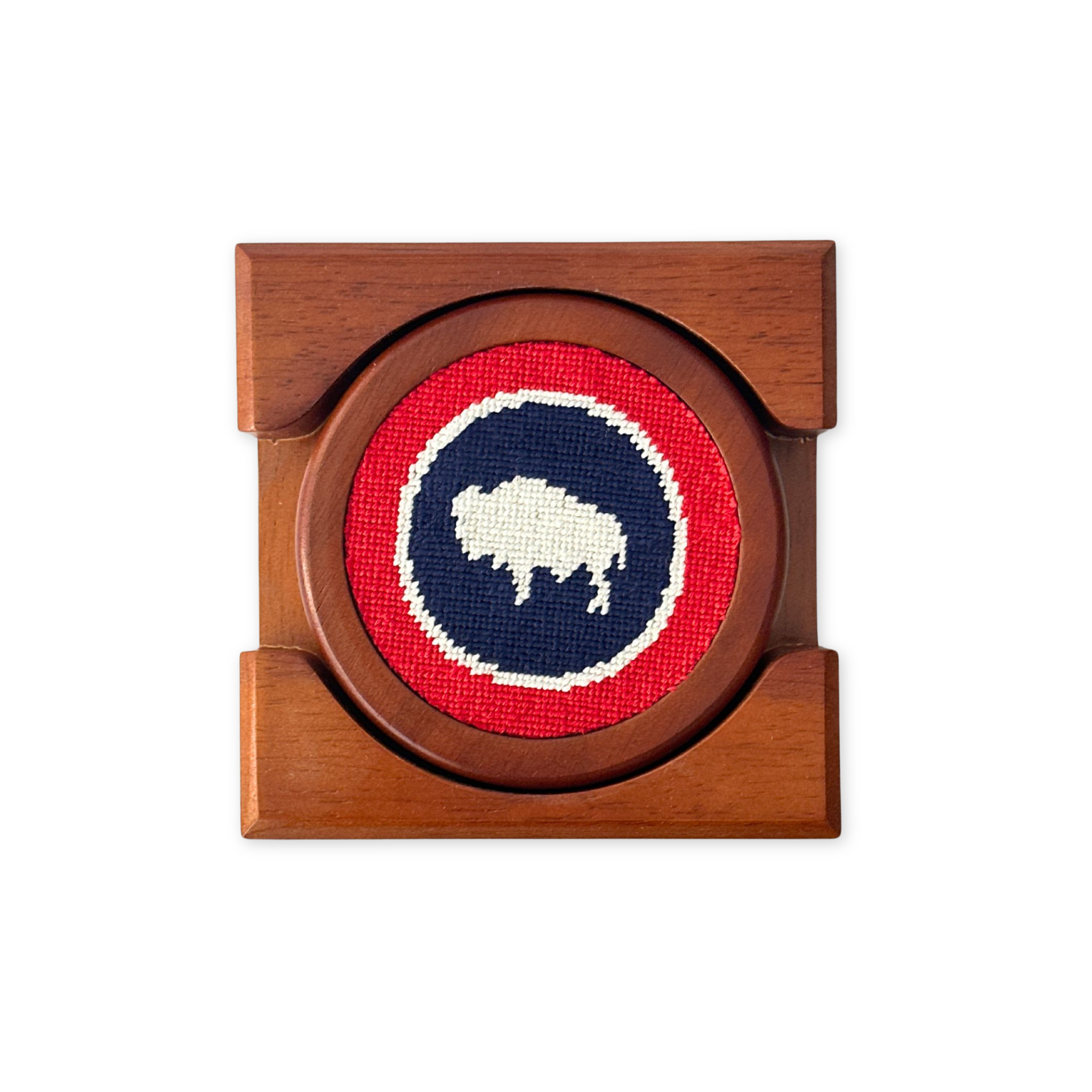 set of four needlepoint and wood coasters with the wyoming flag design in a wooden case