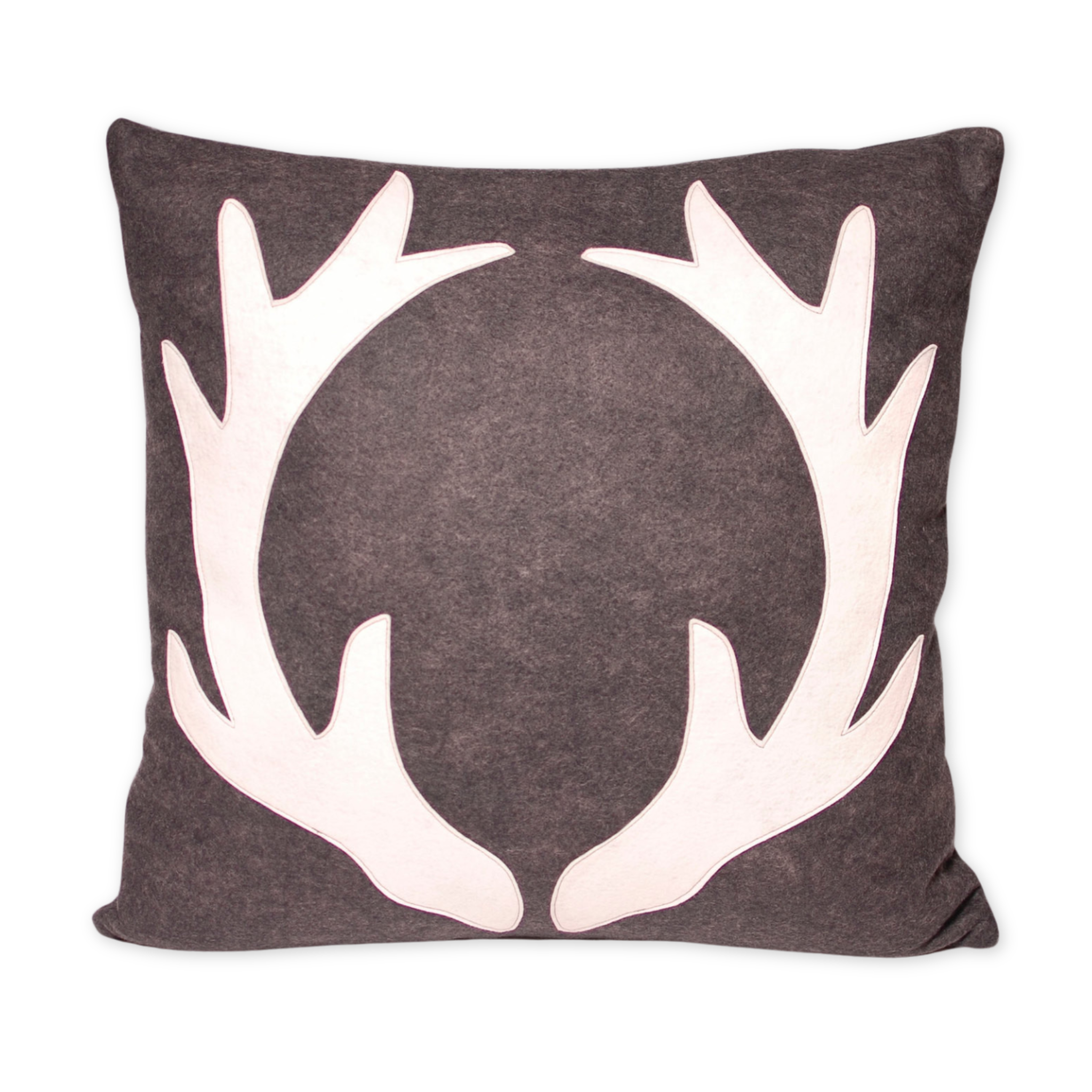 wool and felt pillow with an antler design