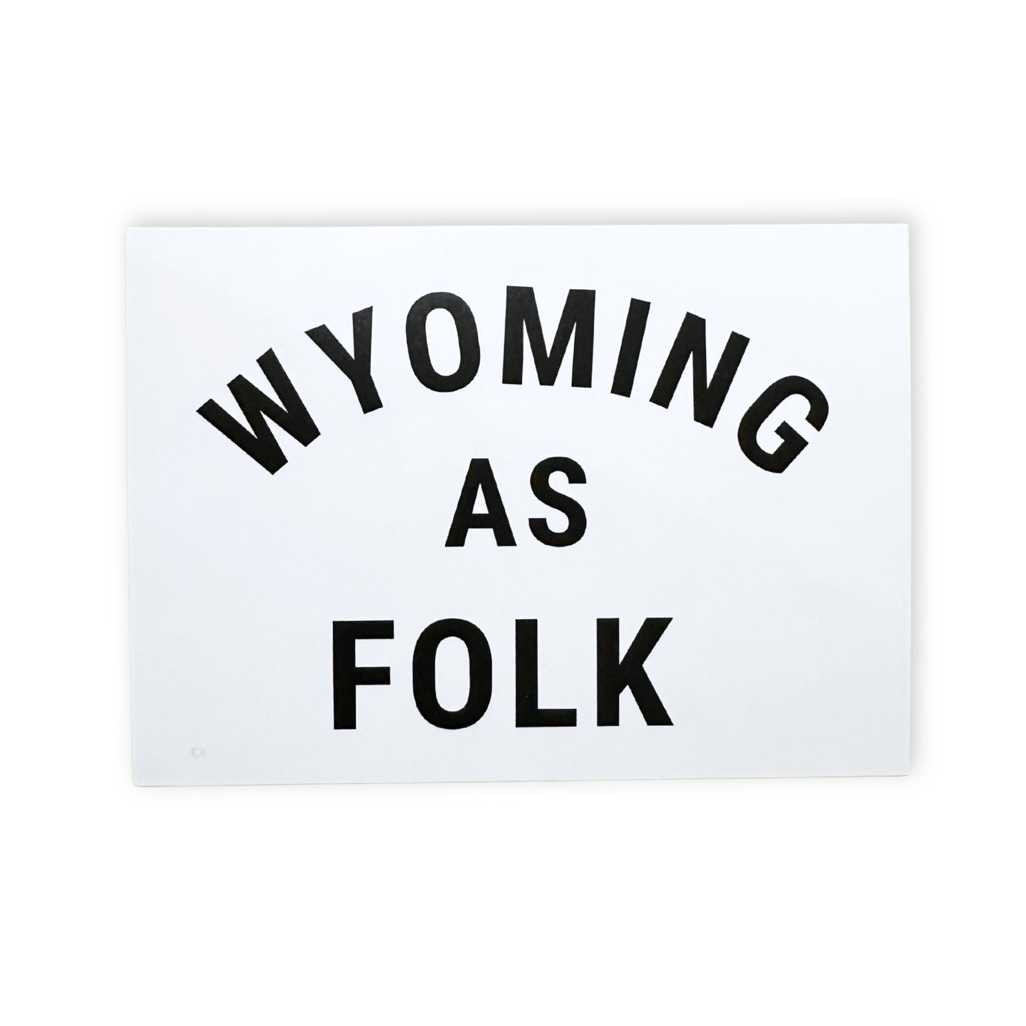 White sign with 'WYOMING AS FOLK' text on a white background