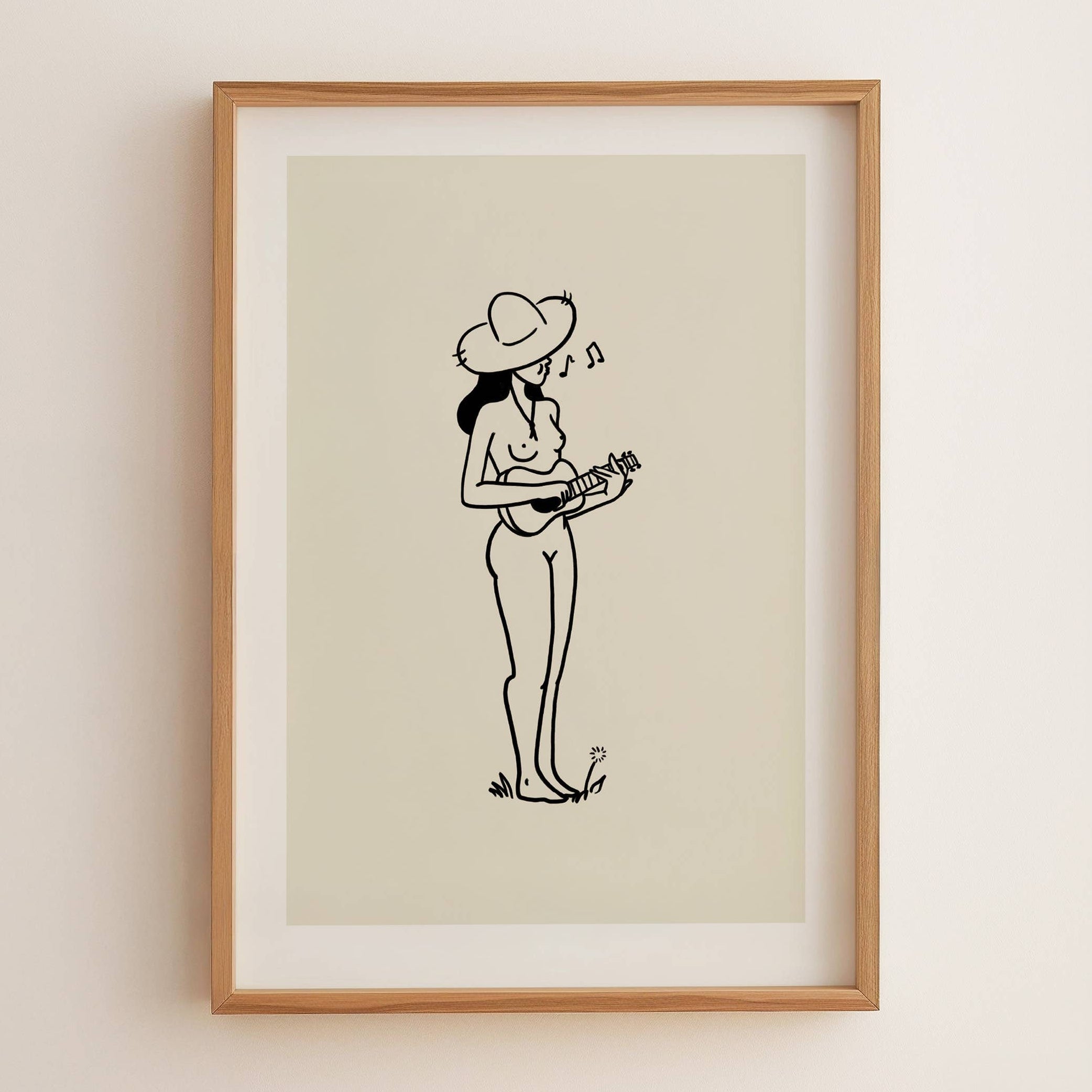 Framed artwork of a woman playing a ukulele on a beige background