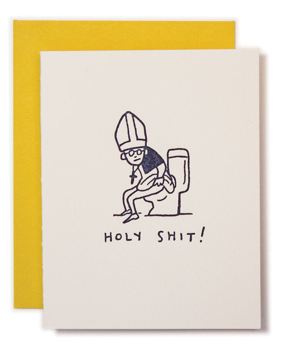 A letterpress card with an illustration of a pope sitting on a toilet and the text 'HOLY SHIT!' printed below. The card is shown with a yellow envelope.